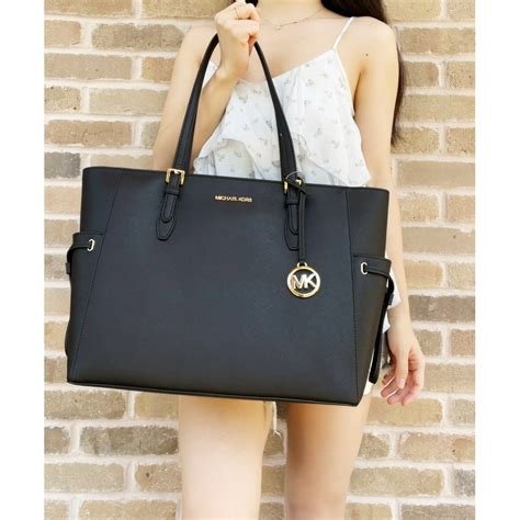 black michael kors purse with zipper flap|michael kors black tote purse.